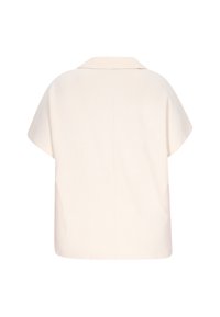 Kortärmad krämfärgad blus med ett texturerat geometriskt mönster och spetsig krage. Avslappnad passform med rak nederkant och detaljerad söm på ryggen.