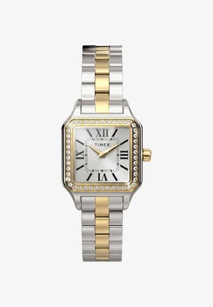 Montre-bracelet carrée argent et or Timex avec chiffres romains, aiguilles dorées, lunette ornée de cristaux et bracelet métallique bicolore.