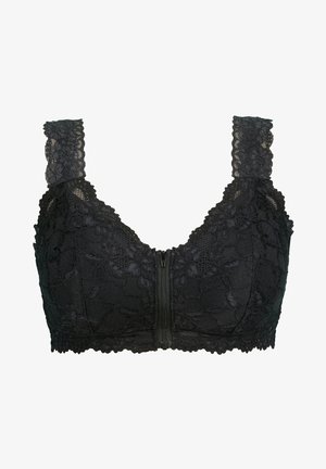 Bra in pizzo nero con tascine larghe, motivo floreale, chiusura frontale con zip e bordi ondulati. Texture morbida, forma strutturata e design a copertura totale.