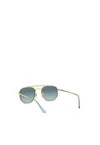 Occhiali da sole ottagonali color oro con lenti blu gradiente, sottili bracci in metallo e cuscinetti nasali in silicone; presentano accenti blu alle estremità delle tempie.