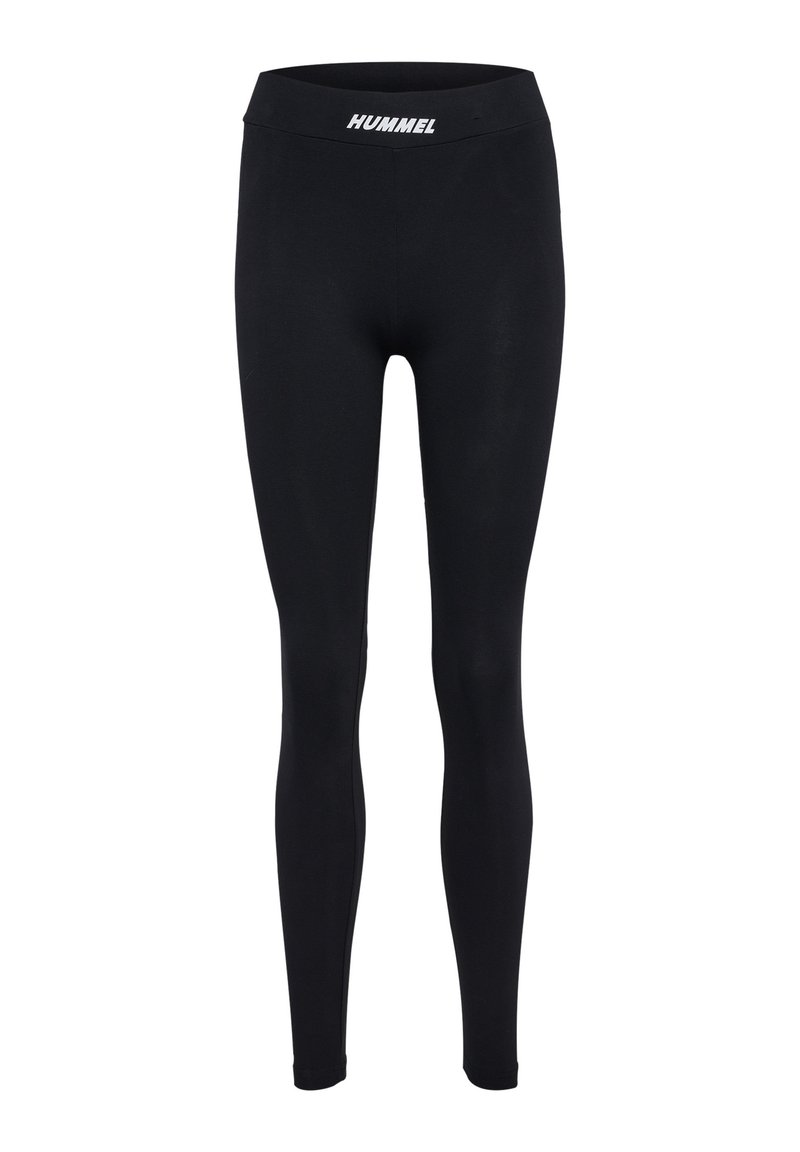 Zwarte leggings van rekbare stof, met een brede tailleband en het witte logo "HUMMEL" op de voorkant. Glad oppervlak, volledige lengte.
