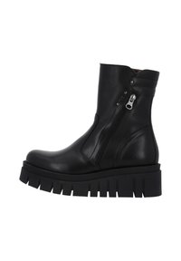Zwarte leren enkelboot met chunky lugzool, rits aan de zijkant en gewatteerde kraagdetails.