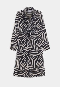 Abito a maniche lunghe con motivo zebra bianco e nero, colletto volant e chiusura con bottoni. Realizzato in un tessuto leggero e liscio.