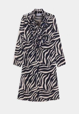 Long-sleeve dress featuring a black and white zebra pattern, ruffled collar, and button-down front. Made from a lightweight, smooth fabric.