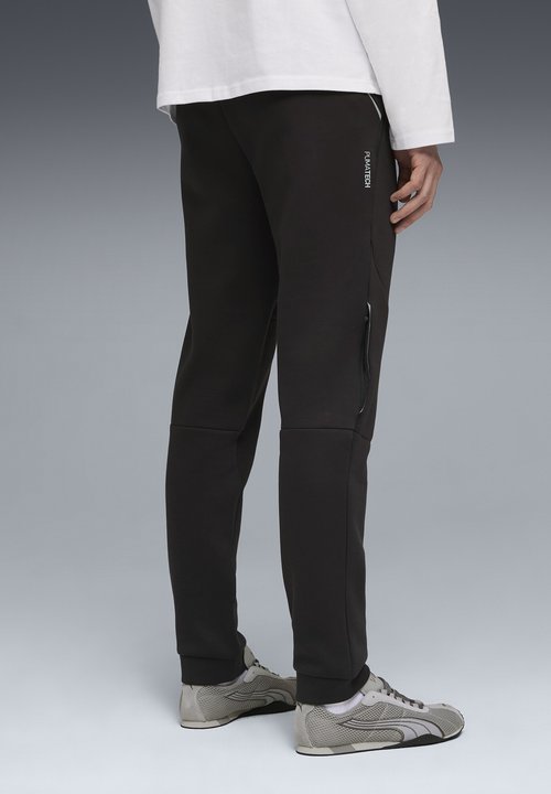 PUMA TECH JOGGING - Tracksuit bottoms - black — photo 3