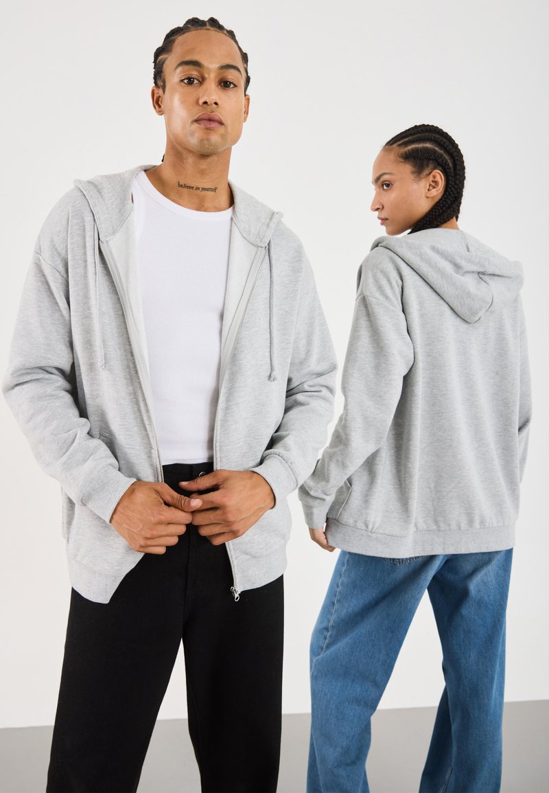 Sweat à capuche zippé à motifs pailletés fille marine | GEMO