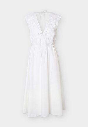 Valge varrukateta midi kleit sügava V-kaelusega, kogutud õlgadega, kaelas ja vööl nöörpaeltega ning voolava A-lõikelise seelikuga.