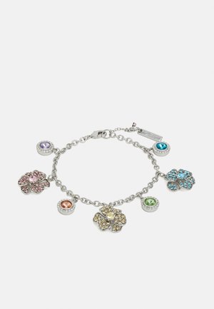 Bracelet chaîne en argent avec des breloques fleurs et rondes en pierres précieuses rose, jaune, bleu, vert, violet et orange sur fond blanc.