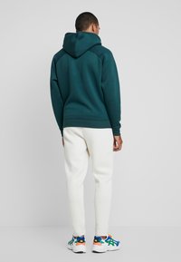 Urban Classics CUT AND SEW PANTS - Tréningruha alsók - sand