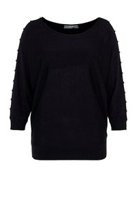 Svart löst sittande tröja med båthals, trekvartslånga ärmar och dekorativa pärlaccenter längs ärmarna. Texturerad stickad tyg.