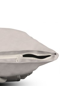Light gray cushion with a textured fabric. Features a contrasting black zipper along the edge and rounded corners.