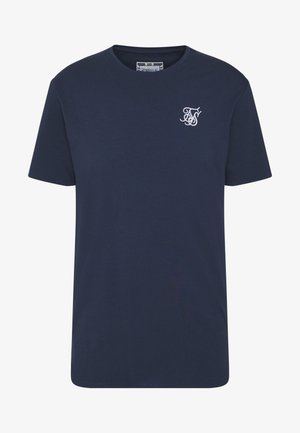 Námořnická modrá bavlněná trička s krátkým rukávem a kulatým výstřihem, s bílými vyšívanými iniciály na levé straně hrudi.