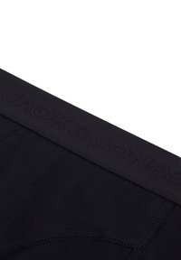 Zwarte boxershorts met een gestructureerde tailleband met de geëtste merknaam "JACK & JONES." Gladde stof met een aansluitende pasvorm.