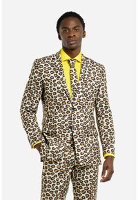 Leopardenmuster-Anzug in Beige, Braun und Schwarz mit passender Hose. Helles gelbes Hemd und Krawatte mit schwarzen Akzenten. Maßgeschneiderte Passform.