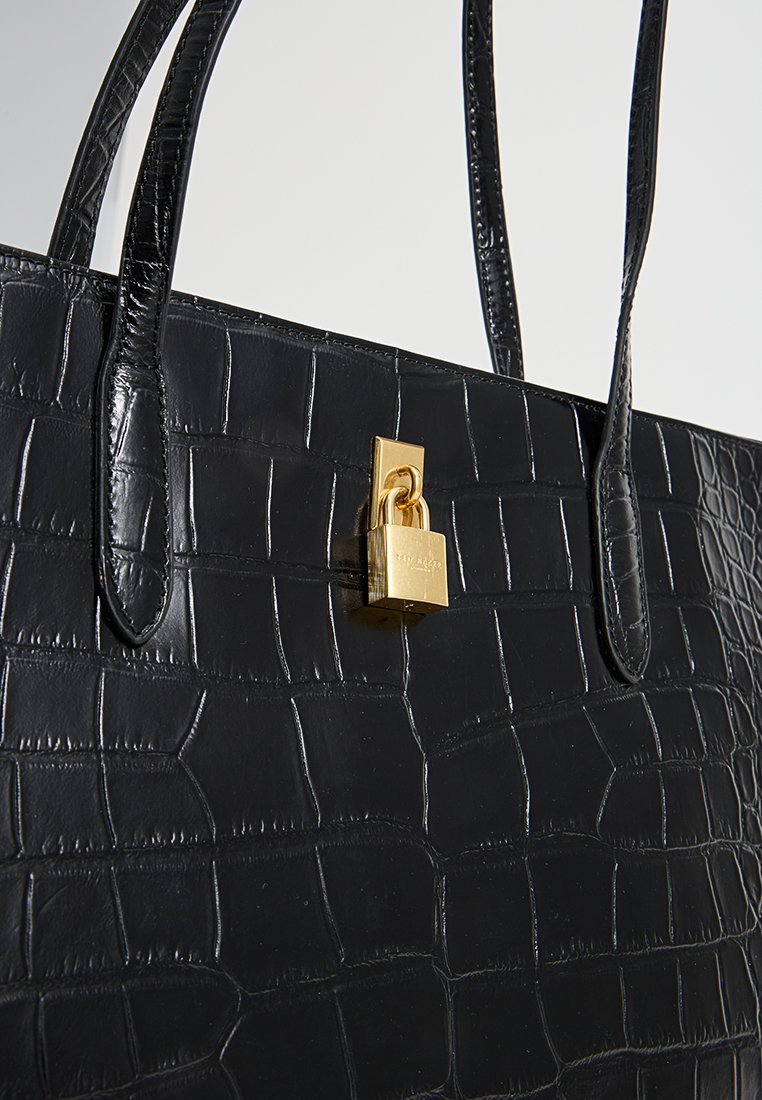 Black crocodile-embossed leather handbag with a gold padlock detail and long handles, featuring a sleek rectangular shape and textured surface.