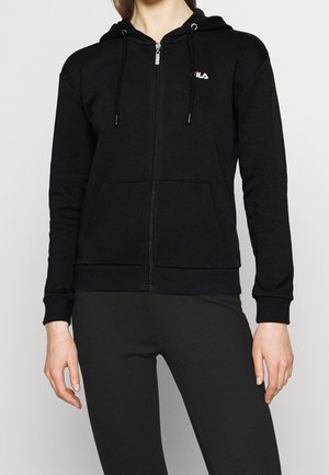 Black zip-up hoodie made of soft fabric with a front pocket, adjustable drawstrings, and a small white logo on the left chest.