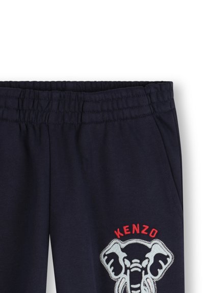 Navy blauwe katoenen joggingbroek met een elastische tailleband, voorzien van een grote witte olifantafbeelding en rode "KENZO" tekst erboven.