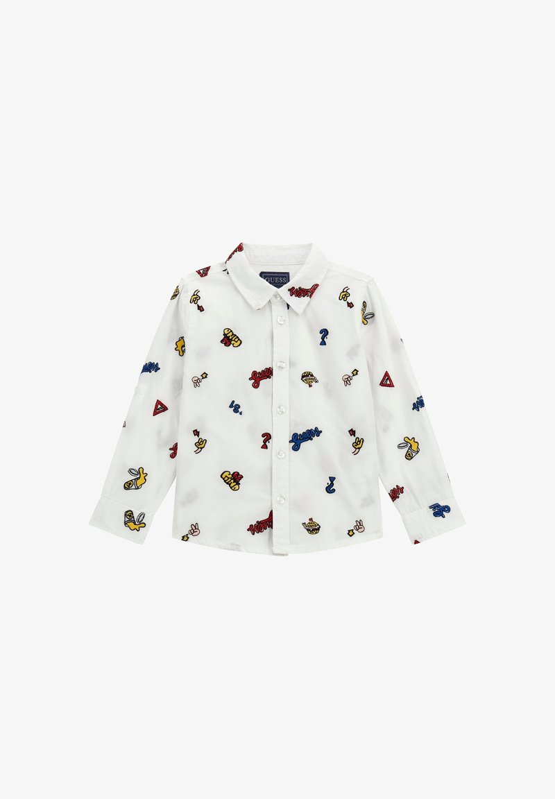 Camicia bianca a maniche lunghe con motivi ricamati colorati, inclusi punti interrogativi, frasi e simboli giocosi. Presenta un colletto classico e bottoni.