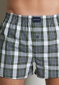 Boxershorts in grün, weiß und marineblauem Karomuster. Mit elastischem Bund und vorderem Knopfverschluss. Glatte Baumwollstoffstruktur.
