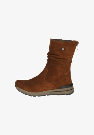 Braune Wildleder-Stiefelette mit lässigem Design, seitlichem Reißverschluss und einer kontrastierenden Gummisohle mit strukturiertem Finish.