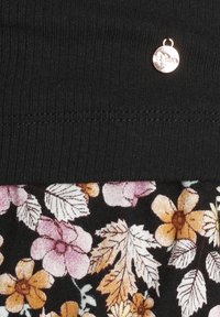 Black ribbed waistband with a small silver logo. The skirt features a multicolored floral pattern on a black background with leaves and flowers.