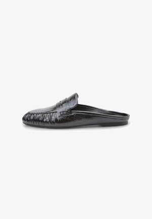 Black leather slip-on shoe with a fringed design, smooth texture, rounded toe, and subtle crackle pattern on the surface.