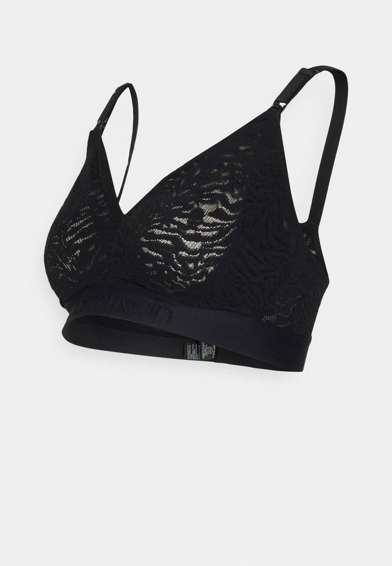 Black lace bralette with a deep V-neck, adjustable straps, and a wide band featuring the brand name, textured pattern on the fabric.