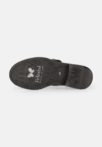Black leather shoe sole with textured surface, printed logo and size markings, featuring a low, sturdy heel design.