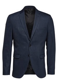 Marineblå blazer laget av teksturert stoff, med en to-knapps front, spiss krage og en brystlomme. Innvendig er den svart.