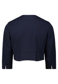 Veste cropped Navy avec un col rond, des manches longues, des fentes latérales et des coutures structurées, fabriquée à partir d'un tissu lisse.