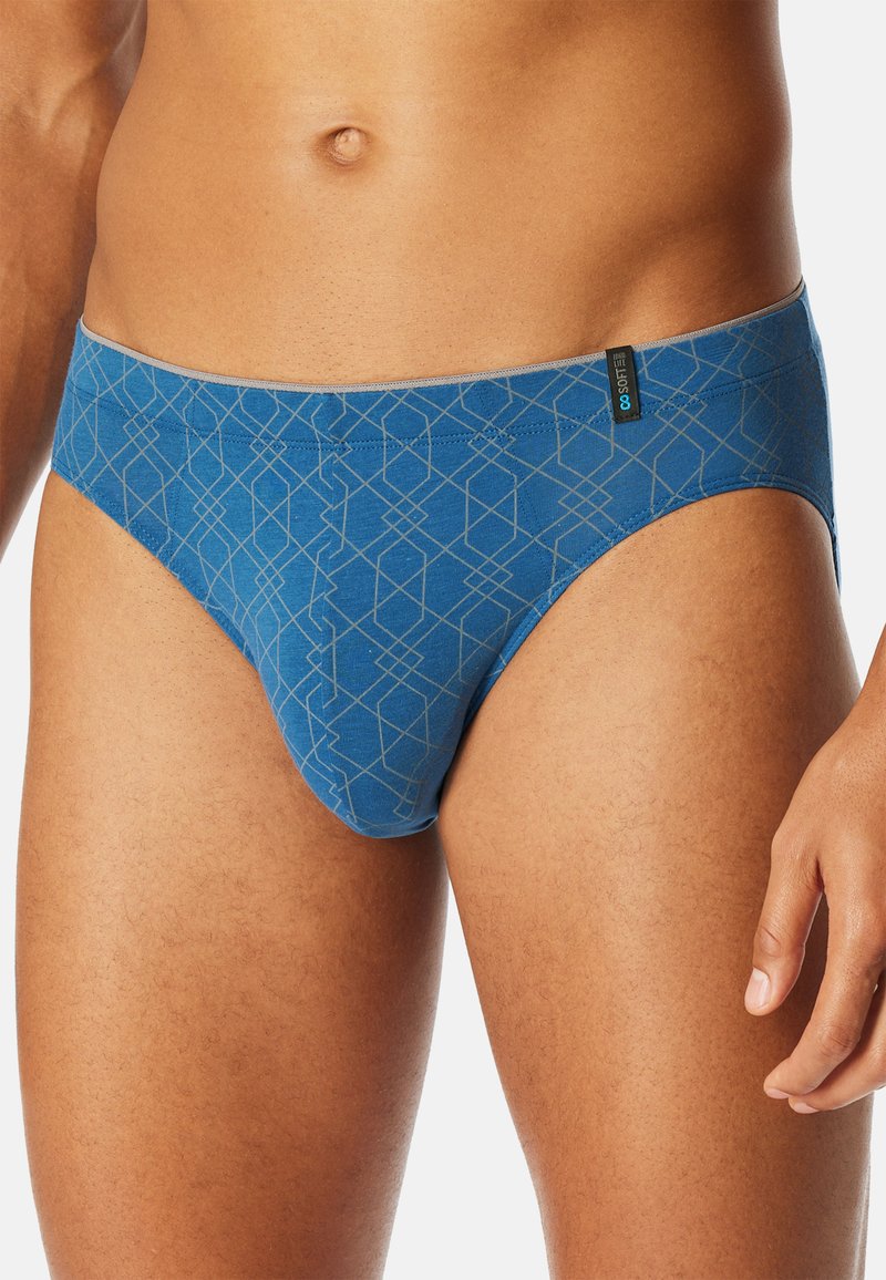 Blue cotton briefs with geometric pattern, featuring a snug fit, elastic waistband, and contrasting stitching detail.