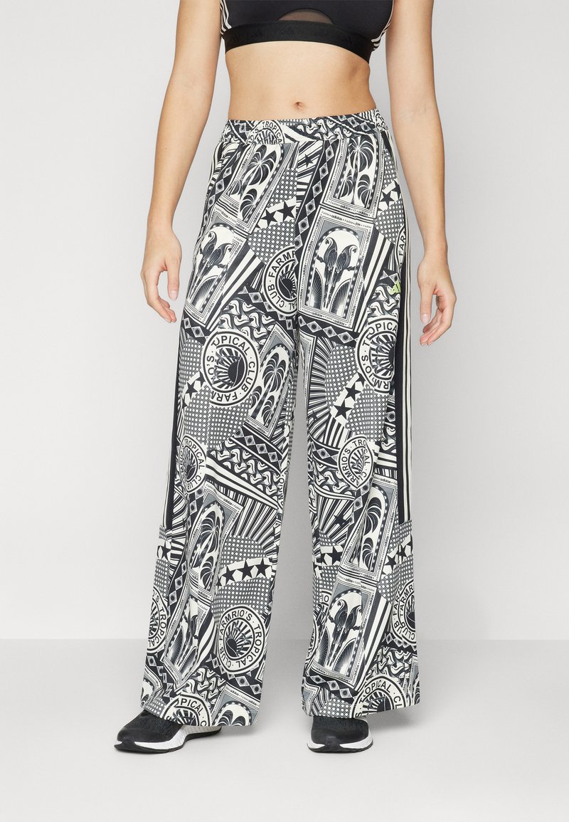 Παντελόνι σε μαύρο και άσπρο σχέδιο με γεωμετρικά και λουλουδάτα μοτίβα. Διαθέτει ελαστική μέση και πλαϊνές ρίγες.
