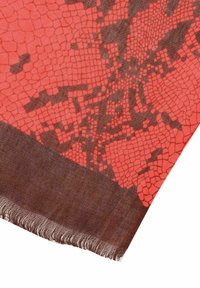 Red and brown scarf featuring a textured snake-skin pattern, with a fringed edge and a smooth, soft fabric finish.