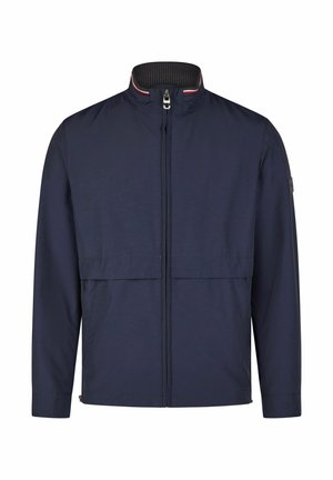 Veste bleu marine avec une fermeture éclair à l'avant, col haut et deux poches à l'avant. Fabriqué en matériau léger avec une texture lisse et des accents minimalistes.