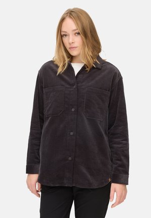 Zwarte corduroy overhemd met twee borstzakken, knoopsluiting, lange mouwen en een gestructureerde stof, met een ronde zoom en een discreet logo detail.