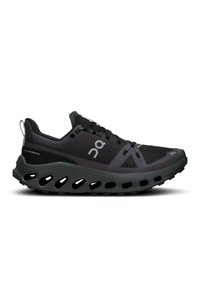 Black athletic shoe with a mesh upper and rubber sole. Features prominent cutouts in the sole for flexibility and ventilation.