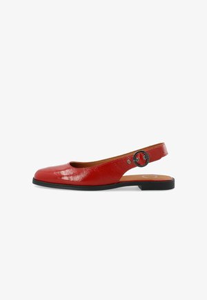 Red patent leather slingback shoe with a rounded toe, a cut-out side, and an adjustable buckle detail on the heel strap. Black sole.