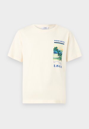 Cream-colored cotton t-shirt featuring a graphic print inspired by Hokusai, with blue and green landscape elements on the chest pocket area.