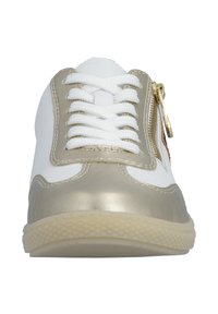 White and metallic gold sneaker with a textured cream sole, featuring flat white laces and a side zipper for easy access.