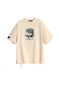 Camiseta grande beige de algodón, con un gráfico central de un personaje de dibujos animados en una combinación de colores gris y blanco y mangas cortas.