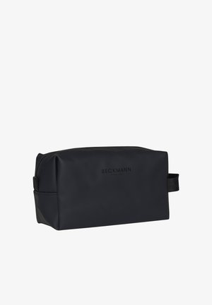 Rektangulær svart toalettmappe med glidelås på toppen, sidehåndtak og diskret "Beckmann Norway 1946"-merke foran.