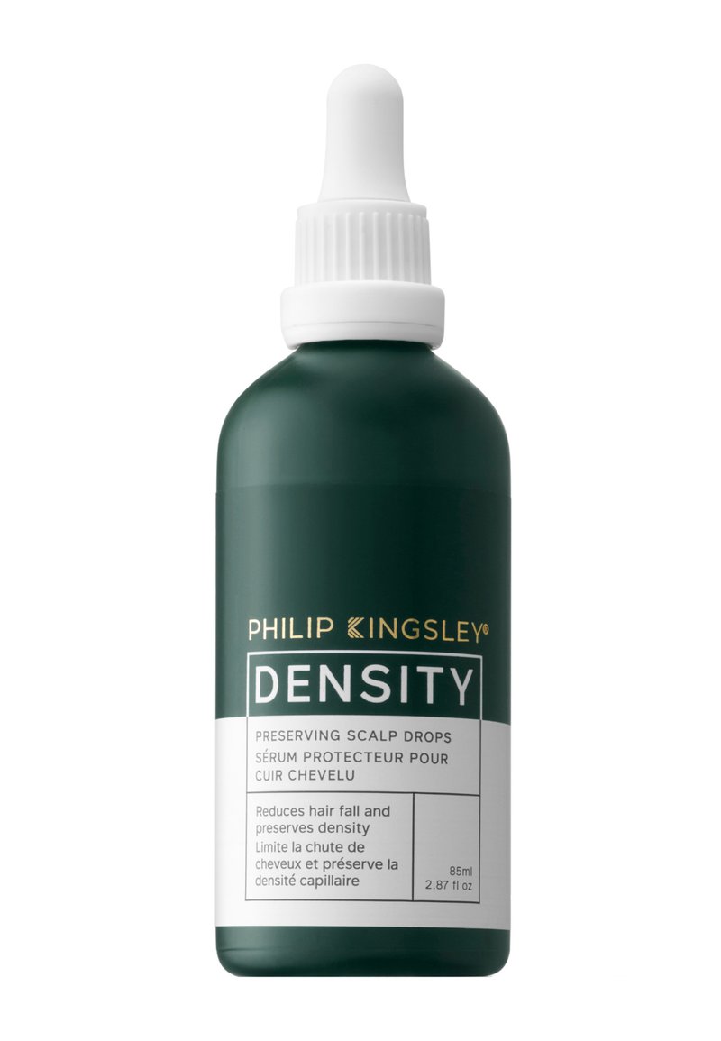 Bottiglia verde con un tappo contagocce bianco, etichettata "Densità", contiene gocce preservanti per il cuoio capelluto. Il testo include i benefici del prodotto e il volume. 85ml.