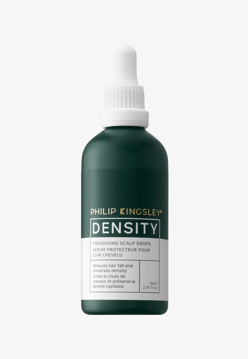 Bottiglia verde con un tappo contagocce bianco, etichettata "Densità", contiene gocce preservanti per il cuoio capelluto. Il testo include i benefici del prodotto e il volume. 85ml.