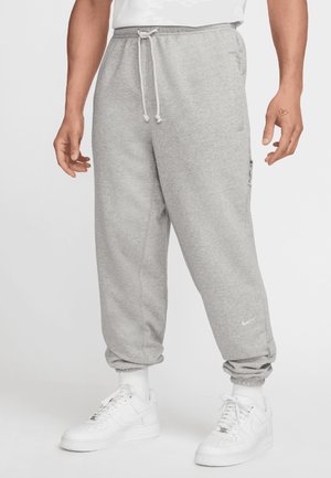 Nike Performance STANDARD ISSUE - Tracksuit bottoms - dark grey heather