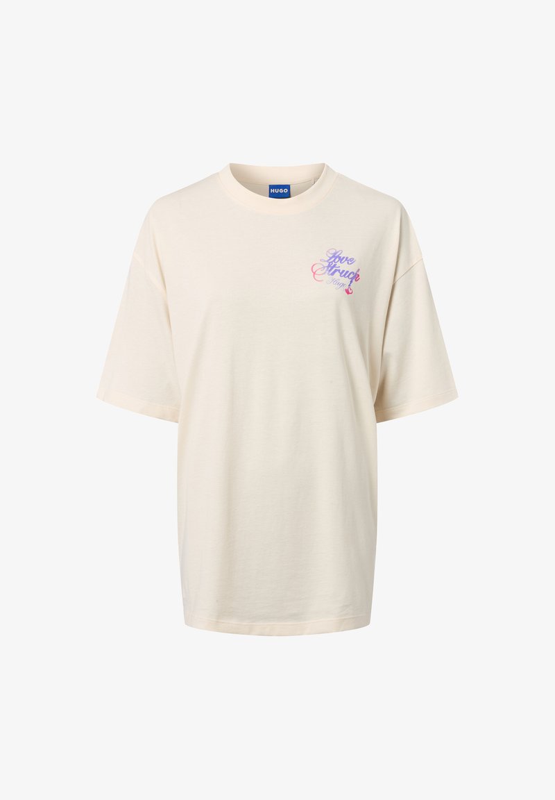 Kremowa bawełniana koszulka z krótkim rękawem. Z przodu, na lewej piersi, znajduje się lekko fioletowy i różowy graficzny wzór z tekstem.