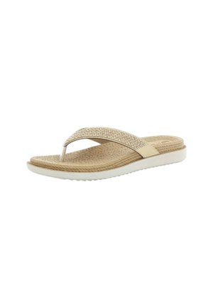 Sandalo beige con cinturino a tanga, sottopiede testurizzato, cinturino decorativo e suola bianca, mostrato su sfondo bianco semplice.