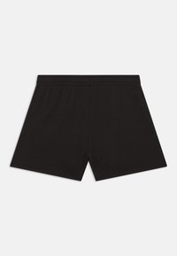 Pantalones cortos de algodón negros con cintura elástica, que presentan un diseño limpio sin patrones ni acentos visibles. Vista trasera mostrada.