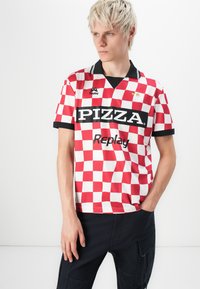 Red and white checkered short-sleeve jersey with black accents, featuring "PIZZA" in bold letters and the brand logo along with two stars.