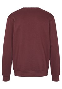 Felpa pullover bordeaux in tessuto texture, con maniche lunghe e orlo a coste. La vista posteriore mostra un design semplice e pulito, senza grafiche.