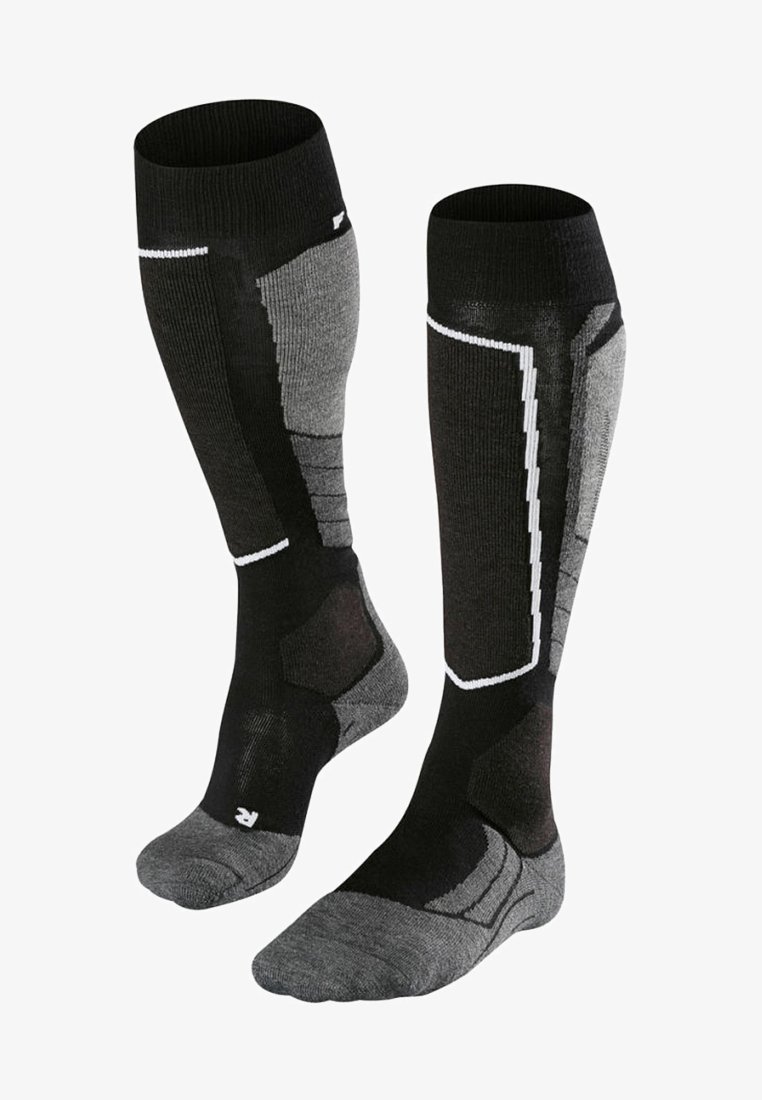 Calze di lunghezza al ginocchio nere e grigie con polsini a coste, suole imbottite e pannelli decorati per il supporto. Presentano punte e talloni rinforzati.